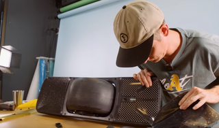 Jeff removing plastic from sensor on Onewheel GT